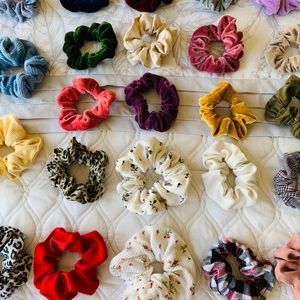 24 scrunchies, some new, some Brandy Melville